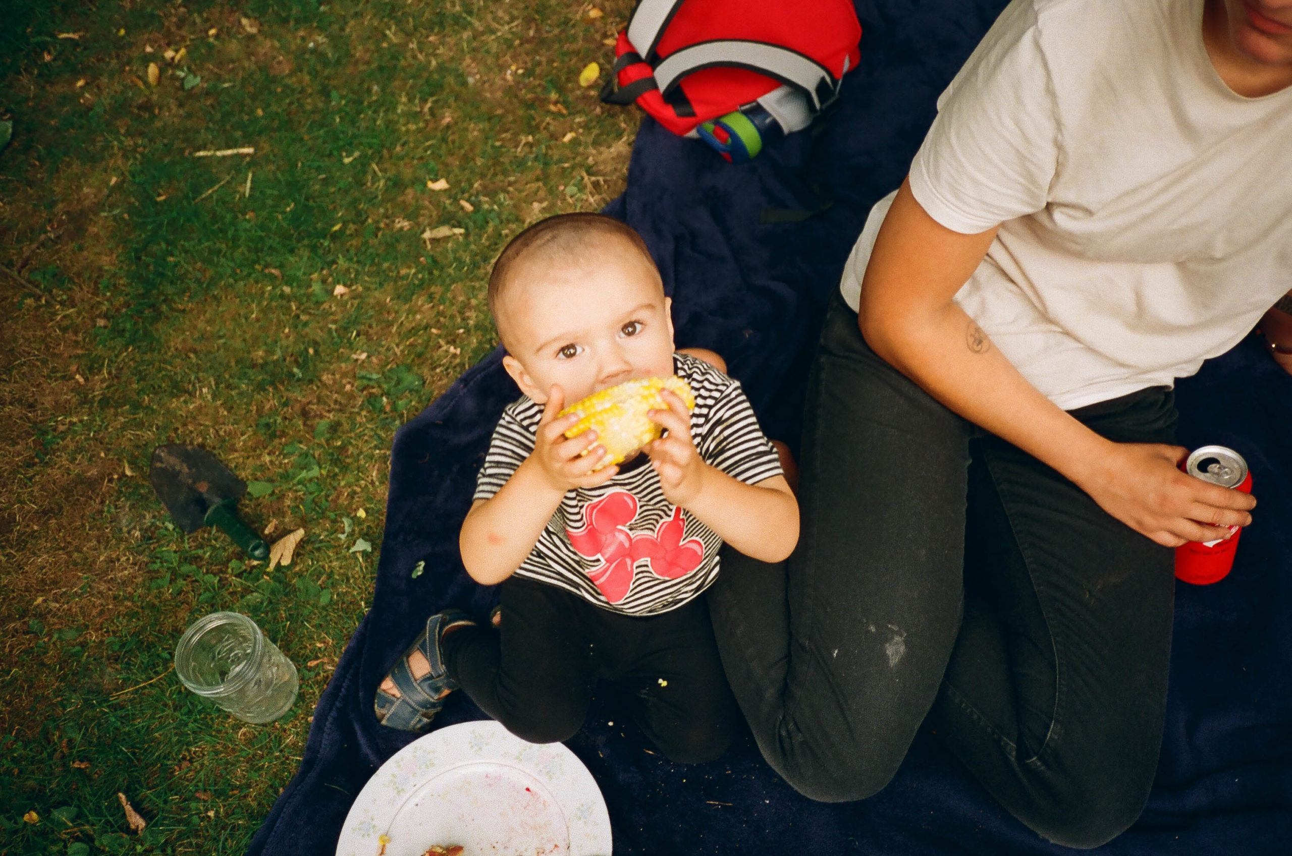 Leif the toddler eats corn