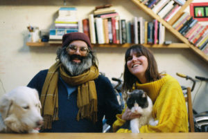 Family portrait of Ajay, Leah, Lou and Leon all sitting at the table